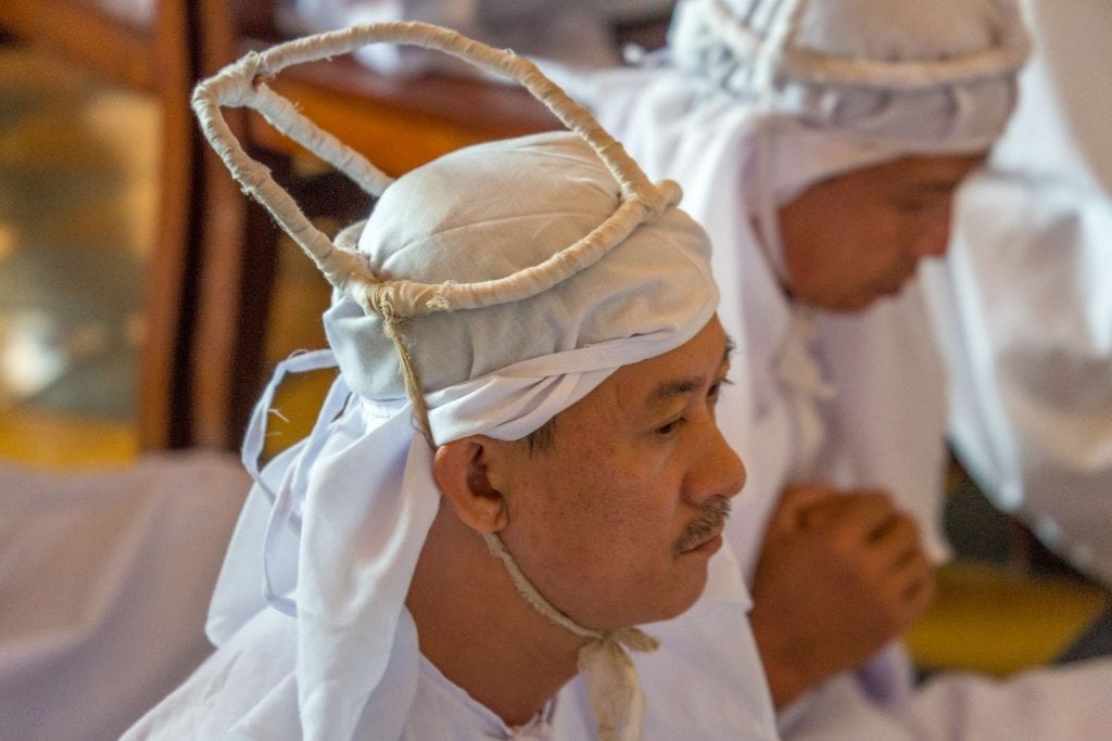 Cao Dai Follower in White - VIETNAM - Must do day trip: Cu Chi tunnels and Cao Dai Temple from Ho Chi Min City