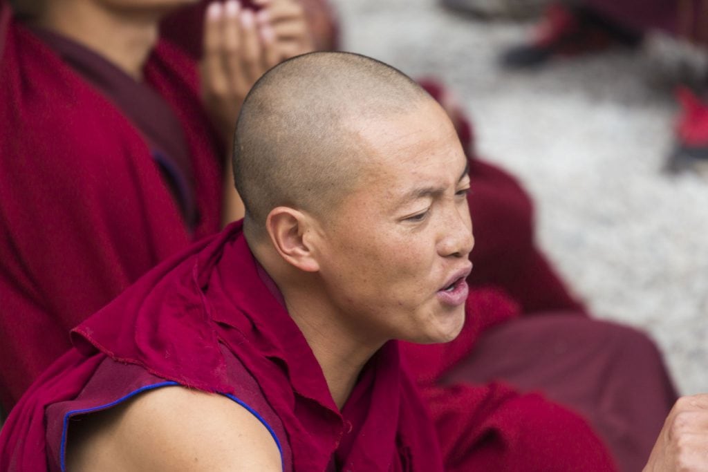 TIBET - Drepung and Sera monastery in Lhasa with monks debating