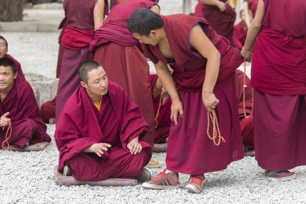 TIBET - Drepung and Sera monastery in Lhasa with monks debating